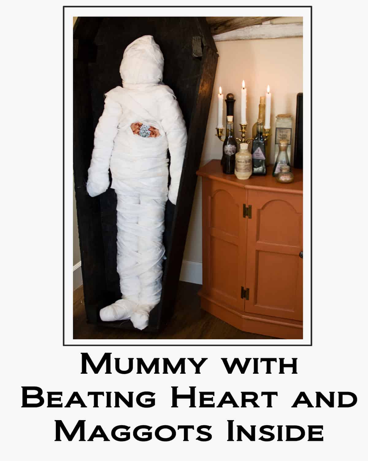 Mummy with Beating Heart and Maggots Inside button 